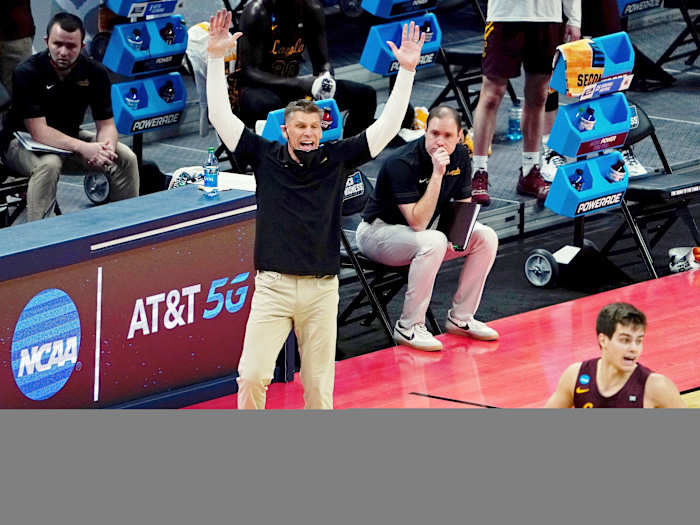 Mar 21, 2021; Indianapolis, Indiana, USA; Loyola Ramblers head coach Porter Moser reacts as guard Braden Norris (4) dribbles the ball against the Illinois Fighting Illini during the first half in the second round of the 2021 NCAA Tournament at Bankers Life Fieldhouse.